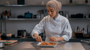 A modern kitchen setup with fresh ingredients, a recipe book, and a chef teaching cooking techniques to a home cook, surrounded by colorful jars and utensils.