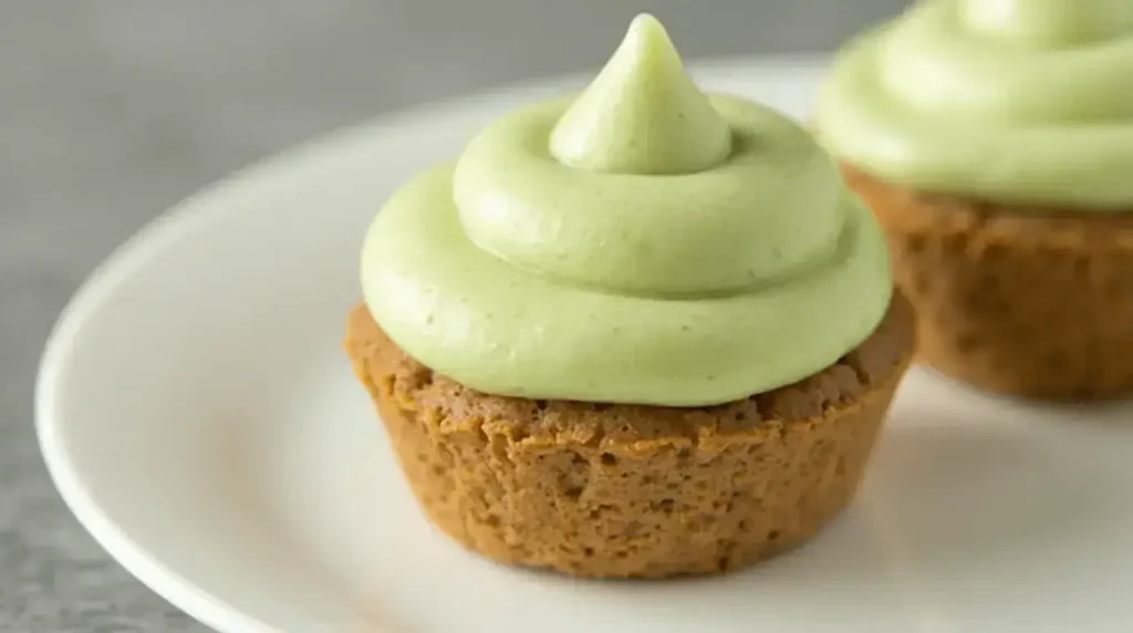 A rich, velvety bowl of pistachio cream paired with pistachios and toast.